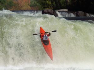 kayaker going over waterfall