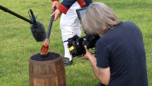 filming gathering black powder for cannon charge