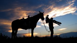 cameraman and guide horse enjoying the sunset